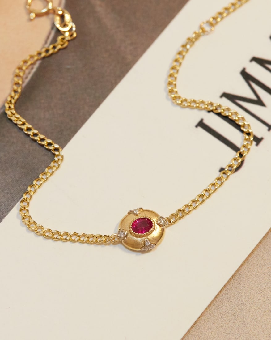 18K Gold Ruby Bracelet: Title: 18K Gold Ruby Bracelet Description: This bracelet features 18K gold, paired with rubies and diamonds, showcasing a subtle and exquisite vintage style. The contrast of yellow and white adds a