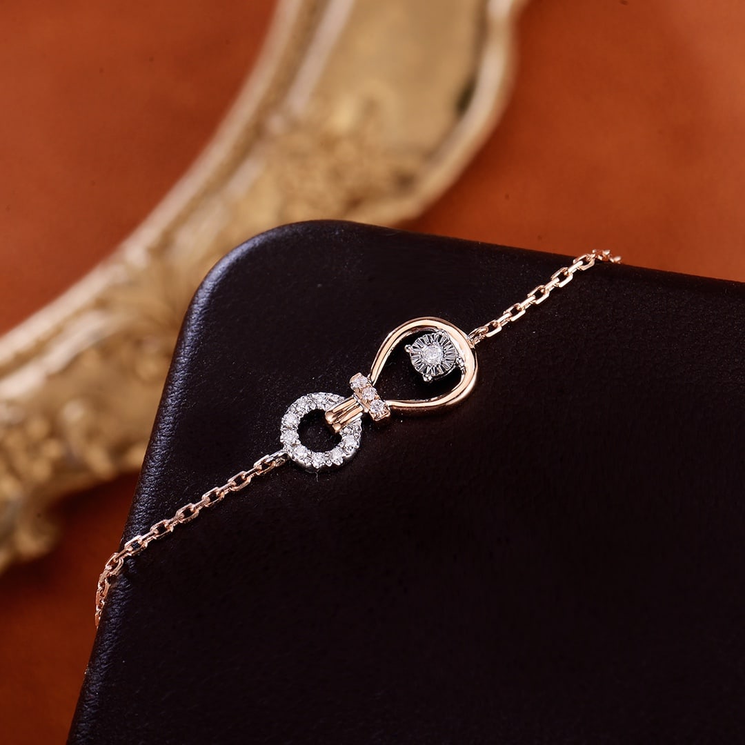 18K Gold Diamond Bracelet: Title: 18K Gold Diamond Bracelet Description: This bracelet showcases the brilliance of diamonds with its simple and elegant design. The 18K gold material adds a touch of luxury to the piece.
