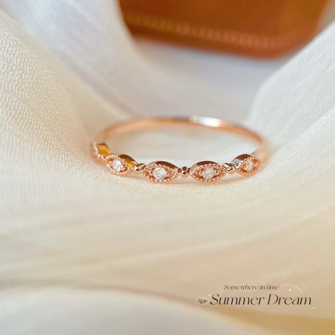 18K Gold Diamond Ring: Title: 18K Gold Diamond Ring Description: This ring is crafted in 18K gold with an intricate hollow pattern design, showcasing a unique artistic flair. Diamonds are set within, adding a touch of