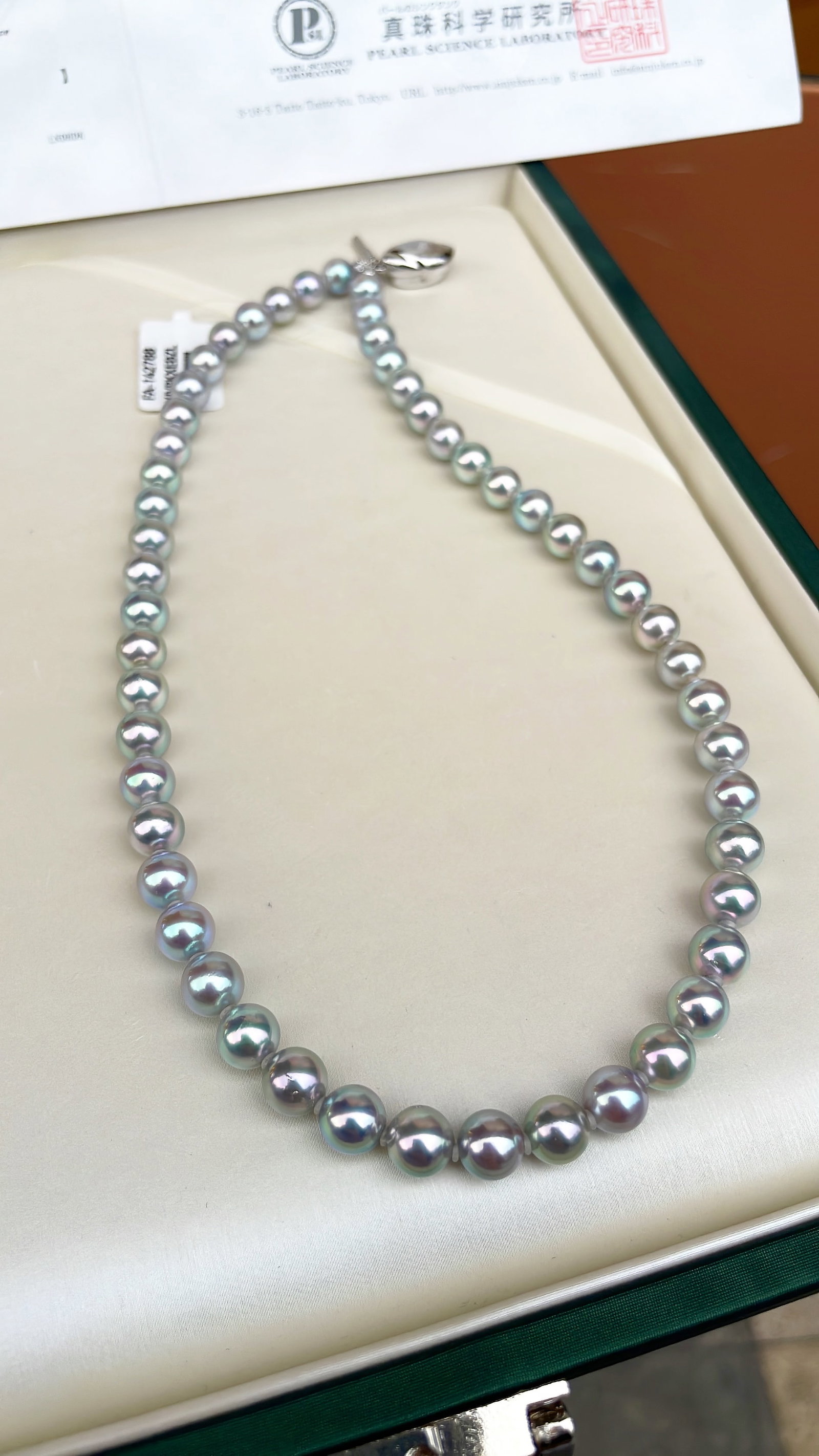 Seawater Pearl Necklace: Title: Seawater Pearl Necklace Description: This necklace showcases the intense luster of seawater pearls, with perfectly round beads and minor blemishes that are not noticeable when worn. (Beads