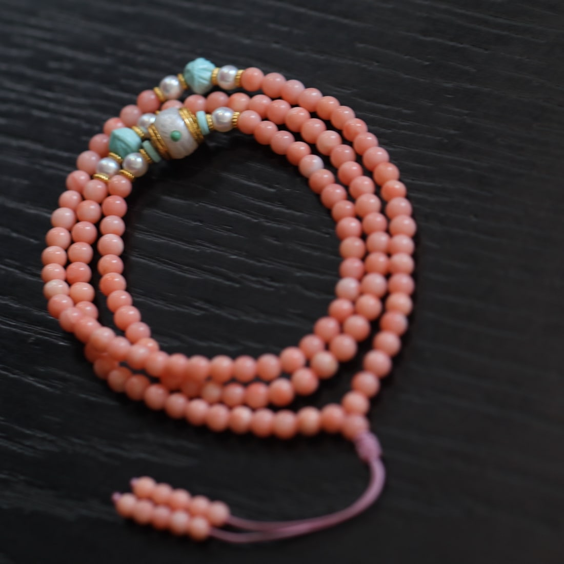 Natural Red Coral Bracelet: Title: Natural Red Coral Bracelet Description: This natural red coral bracelet showcases a simple and stylish charm with its pink round beads. Paired with S925 silver accessories and natural turquoise