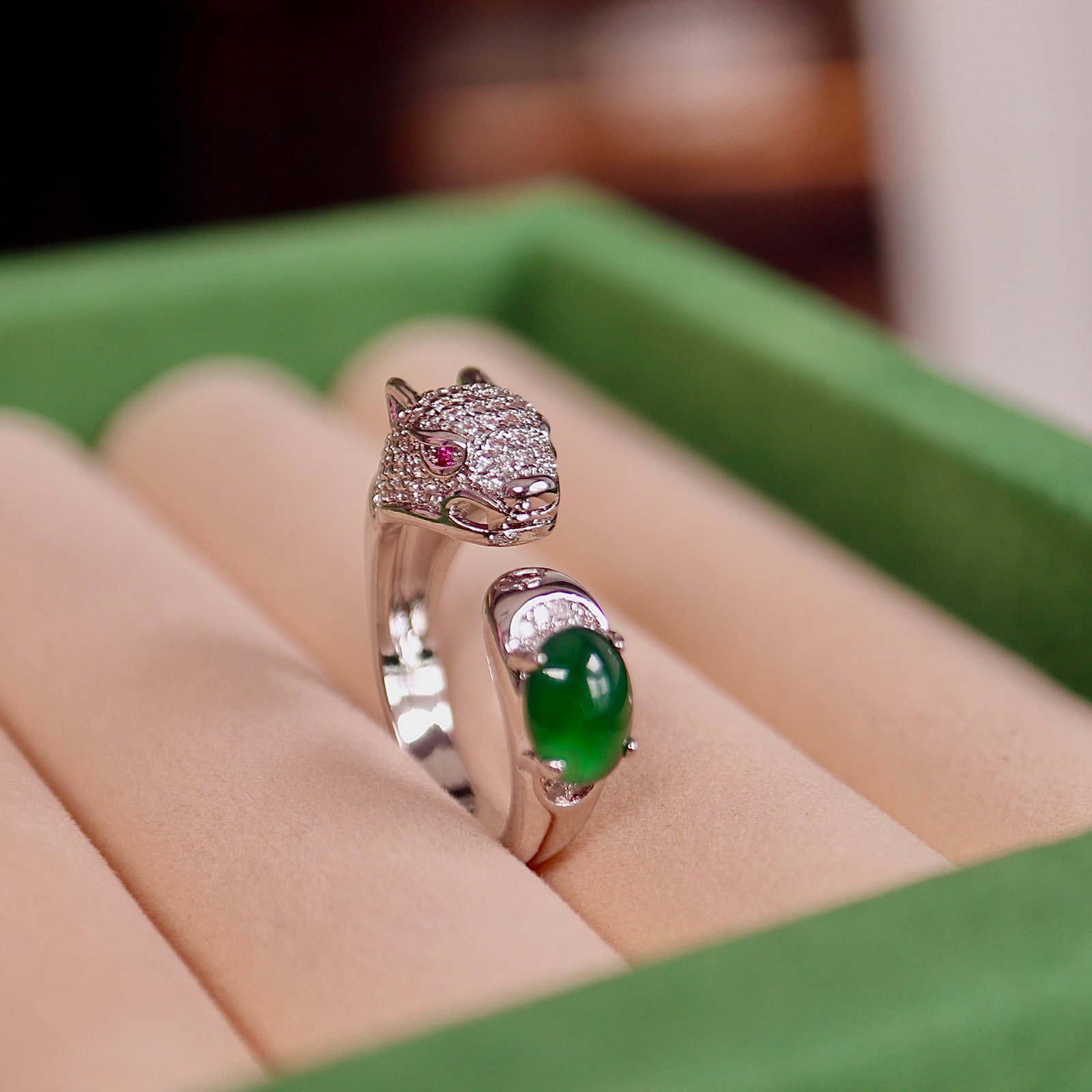 Natural Jadeite Ring: Title: Natural Jadeite Ring Description: This ring features a natural jadeite as the main stone, showcasing a simple yet luxurious design. The jadeite's rich color and fine texture are captivating.