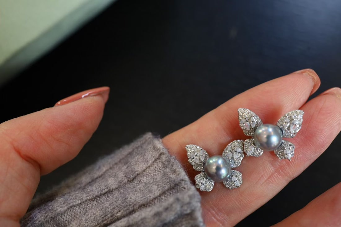Sterling Silver Mabe Pearl Earrings: Title: Sterling Silver Mabe Pearl Earrings Description: These earrings feature Mabe pearls, showcasing the natural luster of the pearls. The sterling silver adds a touch of elegance to the overall