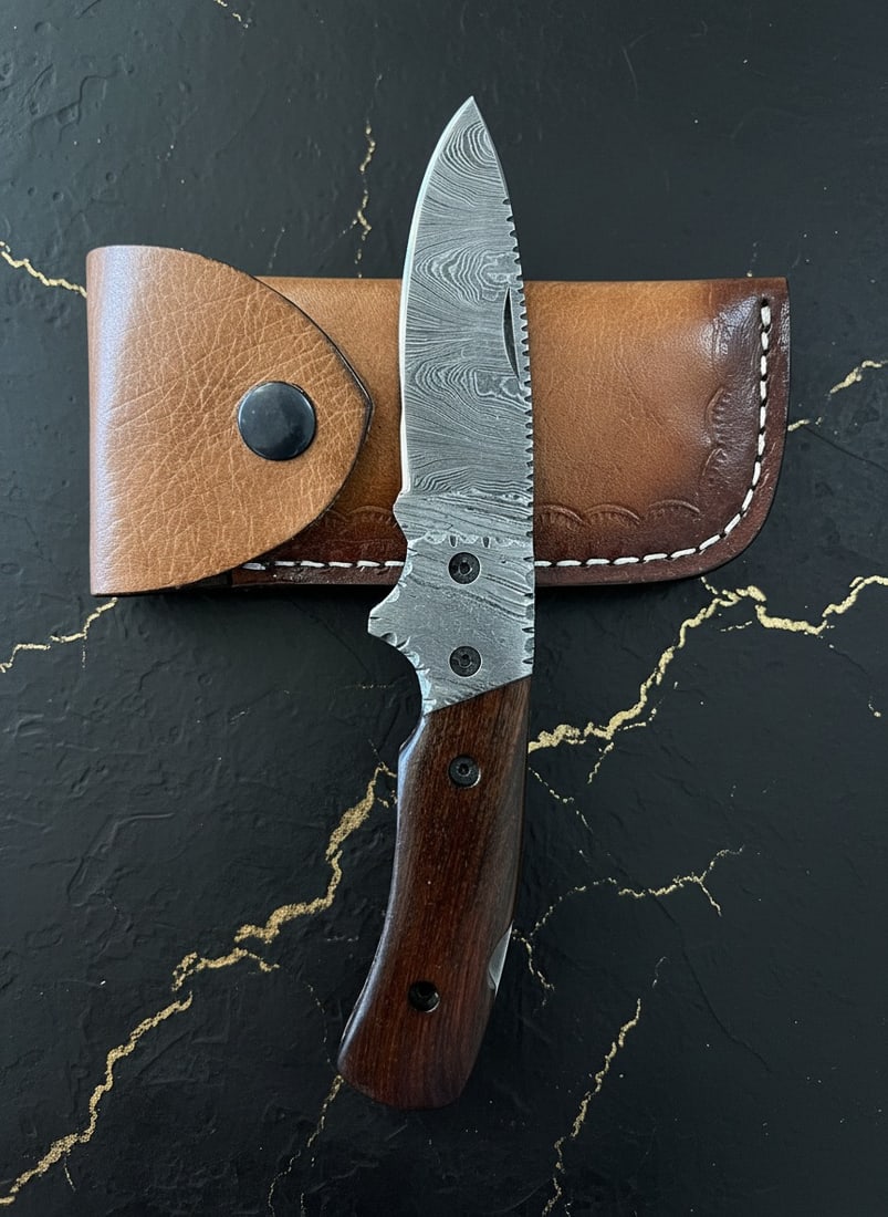 Handmade Damascus Steel Folding Pocket Knife With Wooden Handle & Sheath: Title:Handmade Damascus Steel Folding Pocket Knife With Wooden Handle & Sheath Description:This handcrafted knife features a durable blade and a wood comfort grip handle, accompanied by a cowhide leat