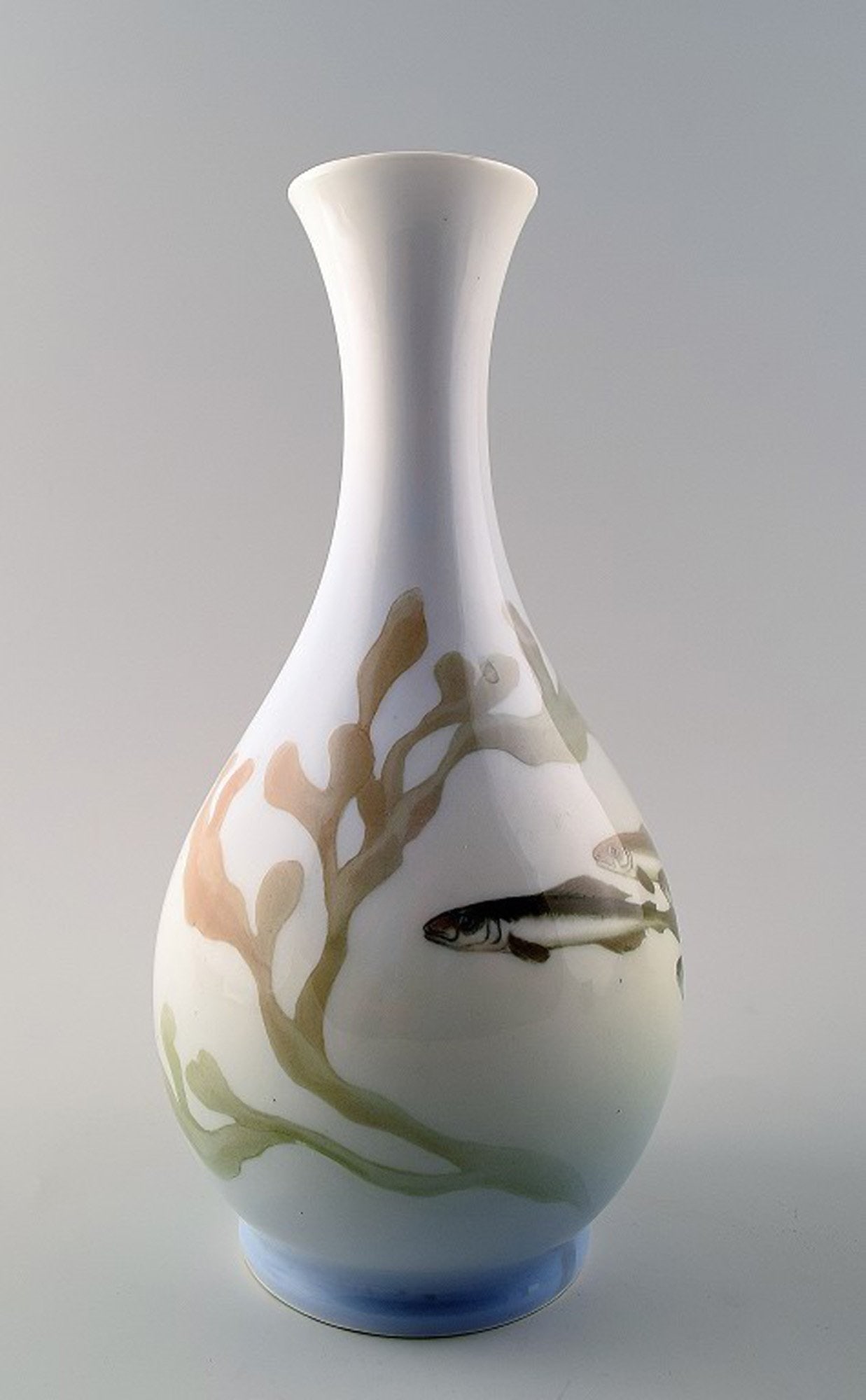 Royal Copenhagen Art Nouveau vase decorated with fish.: Title: Royal Copenhagen Art Nouveau vase decorated with fish. Description: Royal Copenhagen Art Nouveau vase decorated with fish. Measures 22 cm. Marked. 1st. factory quality, in perfect condition. Br