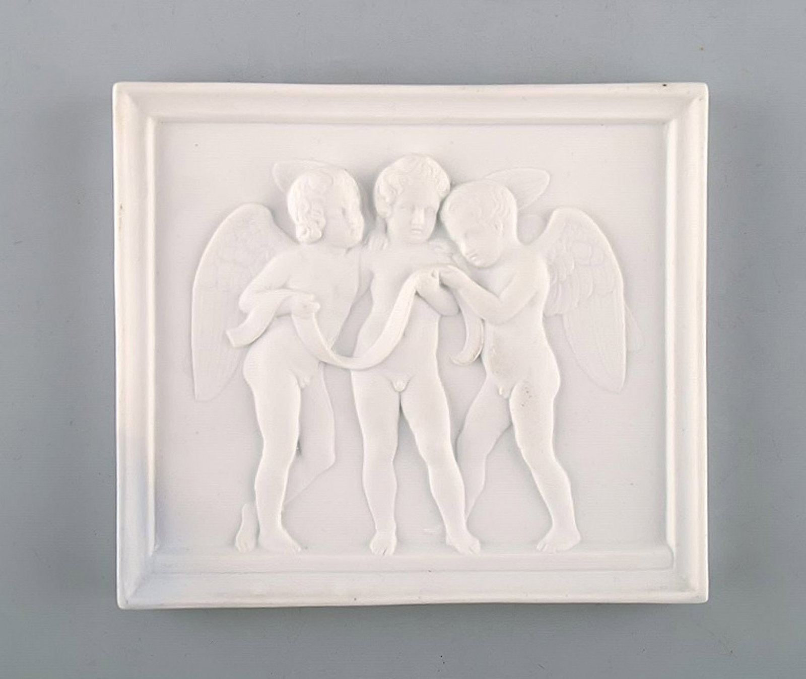 Royal Copenhagen after Thorvaldsen. Antique rare biscuit plaque. Three angel boys. 1870's.: Title: Royal Copenhagen after Thorvaldsen. Antique rare biscuit plaque. Three angel boys. 1870's. Description: Royal Copenhagen after Thorvaldsen. Antique rare biscuit plaque. Three angel boys. 1870's