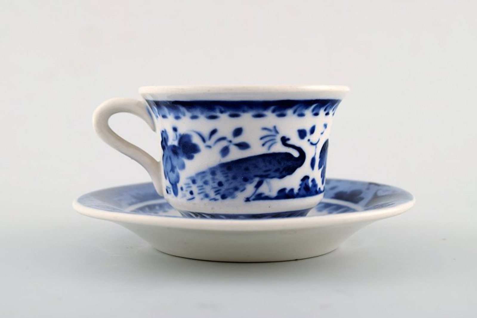 Peacock from Copenhagen faience / Aluminia. Coffee / mocha cup with saucer in faience. (1 of 4)