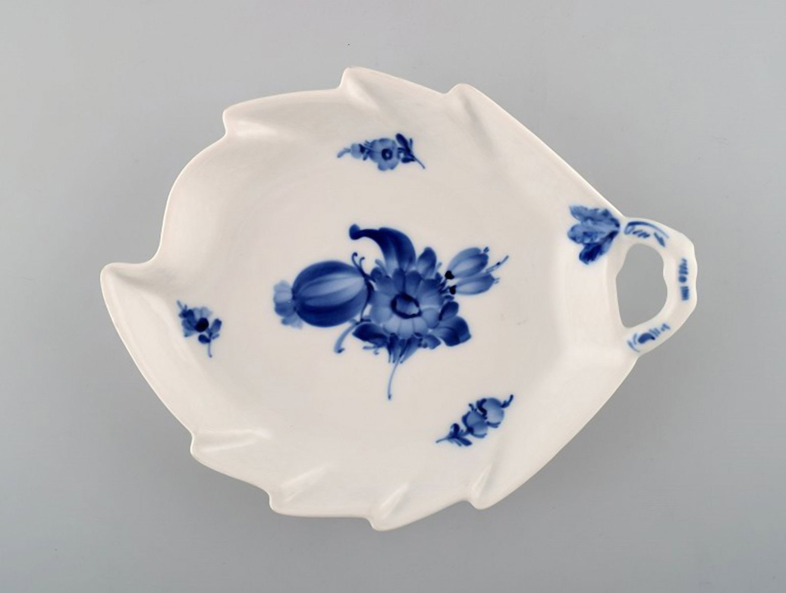 Blue flower braided leaf-shaped dish from Royal Copenhagen.: Title: Blue flower braided leaf-shaped dish from Royal Copenhagen. Description: Blue flower braided leaf-shaped dish from Royal Copenhagen. Stamped. Number 10/8002. 1st factory quality. In perfect con