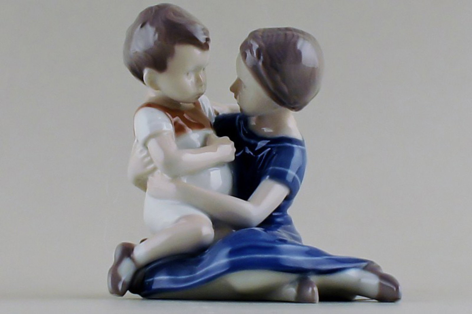 B&G (Bing & Grondahl) mother and boy, number 1568.: Title: B&G (Bing & Grondahl) mother and boy, number 1568. Description: B&G (Bing & Grondahl) mother and boy, number 1568. Early stamp. 14 cm. high. Factory first in good condition. Brand: Bing &