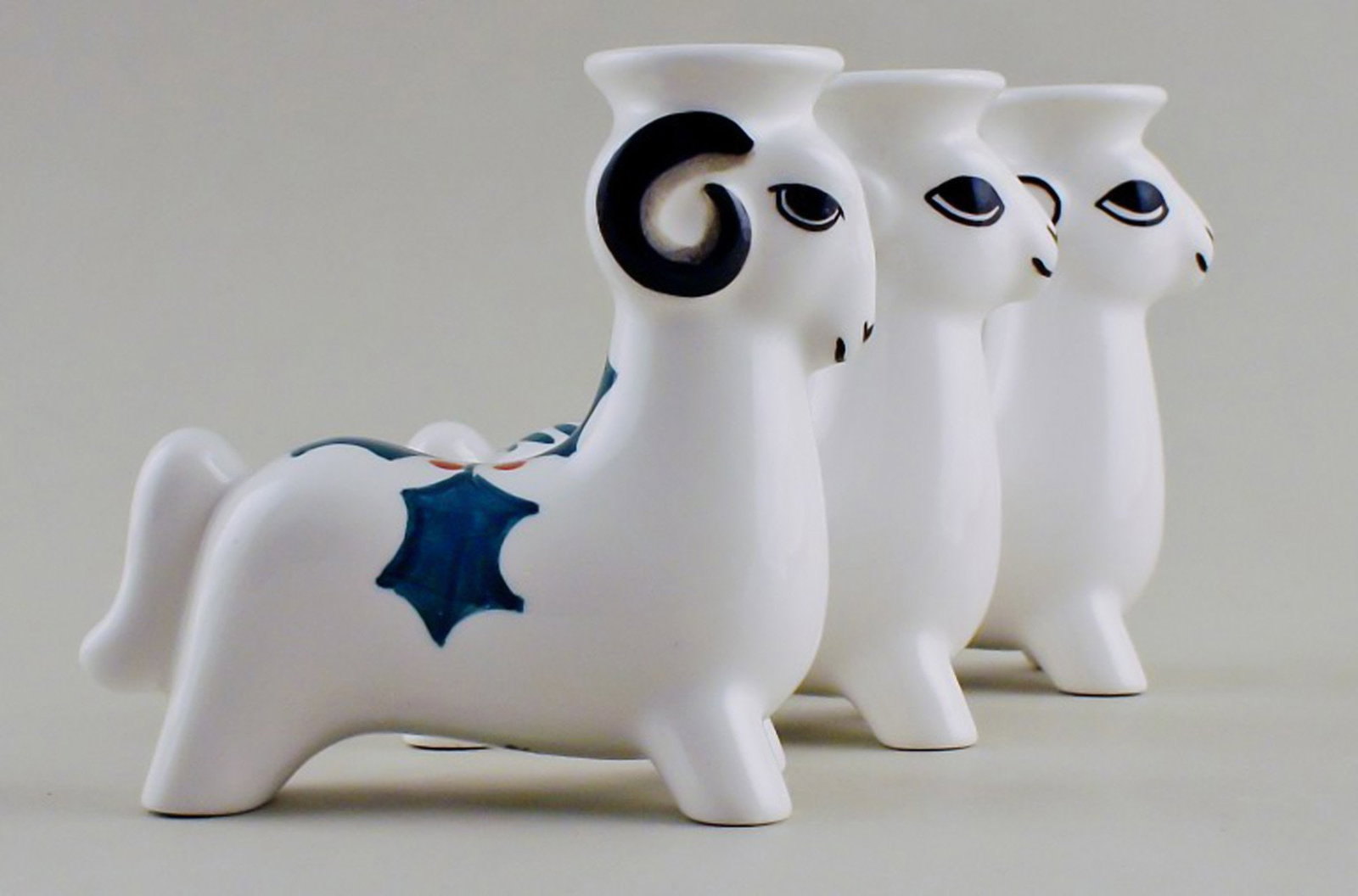 Royal Copenhagen faience candlesticks, Christmas bucks. 3 pcs. in stock.: Title: Royal Copenhagen faience candlesticks, Christmas bucks. 3 pcs. in stock. Description: 3 Royal Copenhagen faience candlesticks, Christmas bucks. In perfect condition. Measures 10 x 10 cm. Stampe