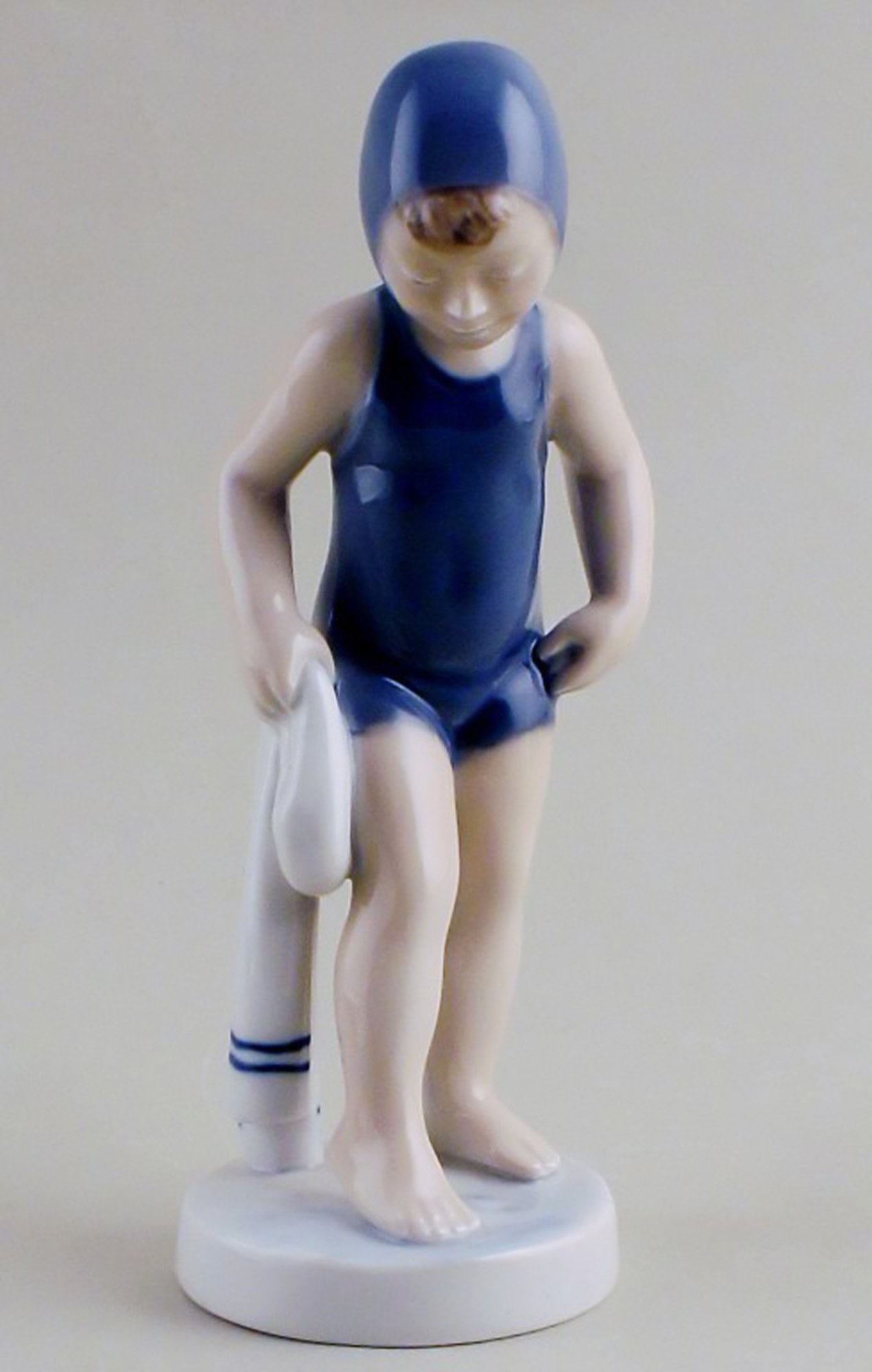 Royal Copenhagen number 4529, July - girl bathing.: Title: Royal Copenhagen number 4529, July - girl bathing. Description: Royal Copenhagen number 4529, July - girl bathing. Designed by Hans Henrik Hansen (1894-1965). In mint condition, factory first.