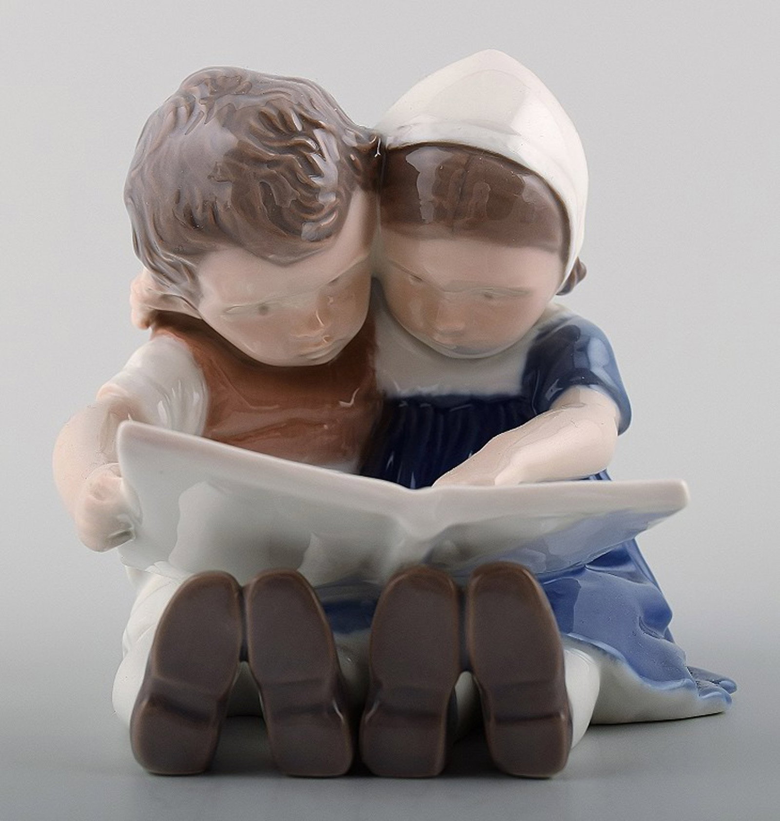 1567 Bing & Grondahl ,b&g, Porcelain Figurine girl and boy reading. (1 of 4)