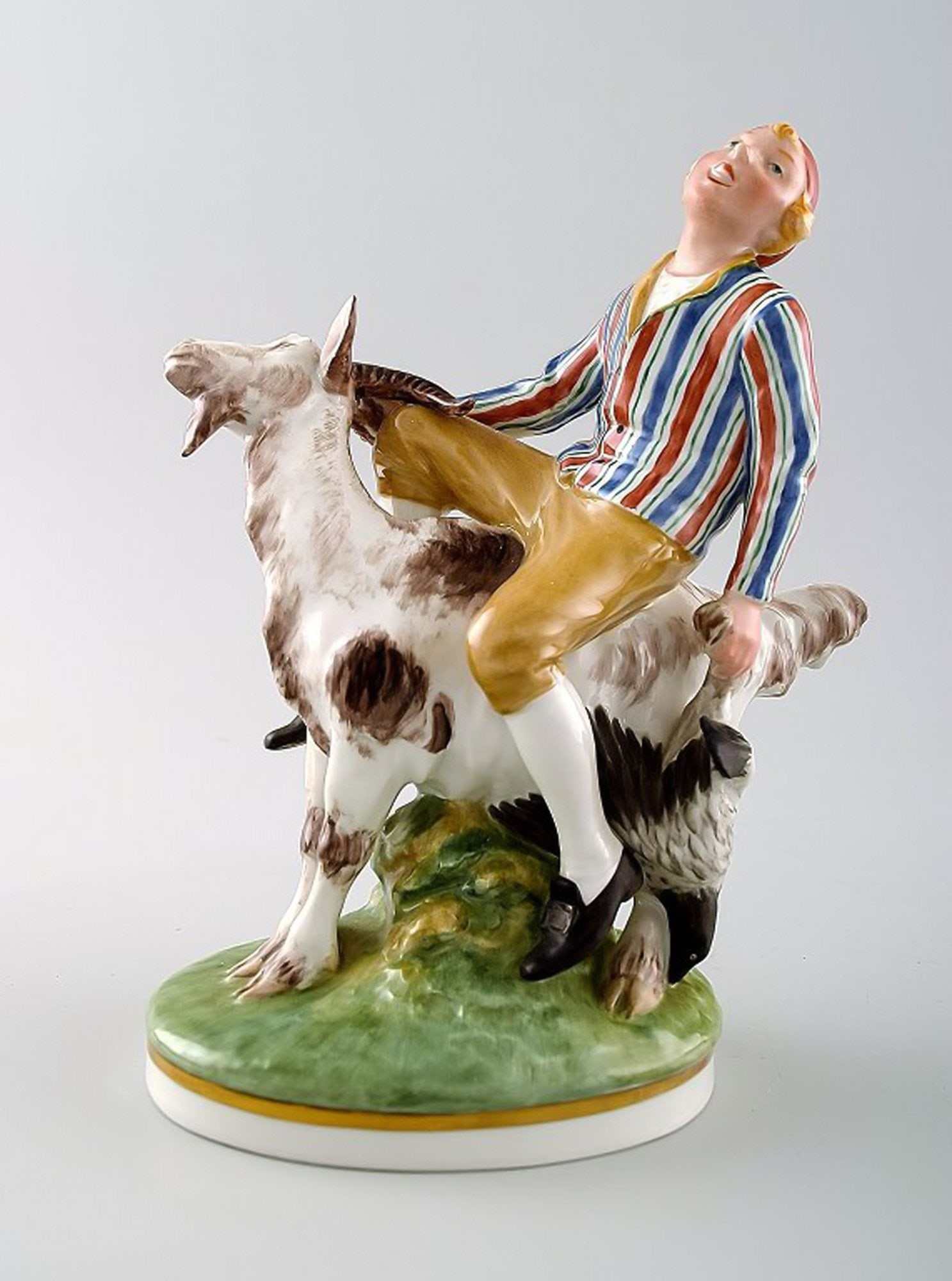 Royal Copenhagen, Julian Marie's mark. Porcelain figure decorated in overglaze, 'Clumsy Hans' No.: Title: Royal Copenhagen, Julian Marie's mark. Porcelain figure decorated in overglaze, 'Clumsy Hans' No. 1228. After fairytale by H. C. Andersen. Description: Royal Copenhagen, Julian Marie's mark. Po