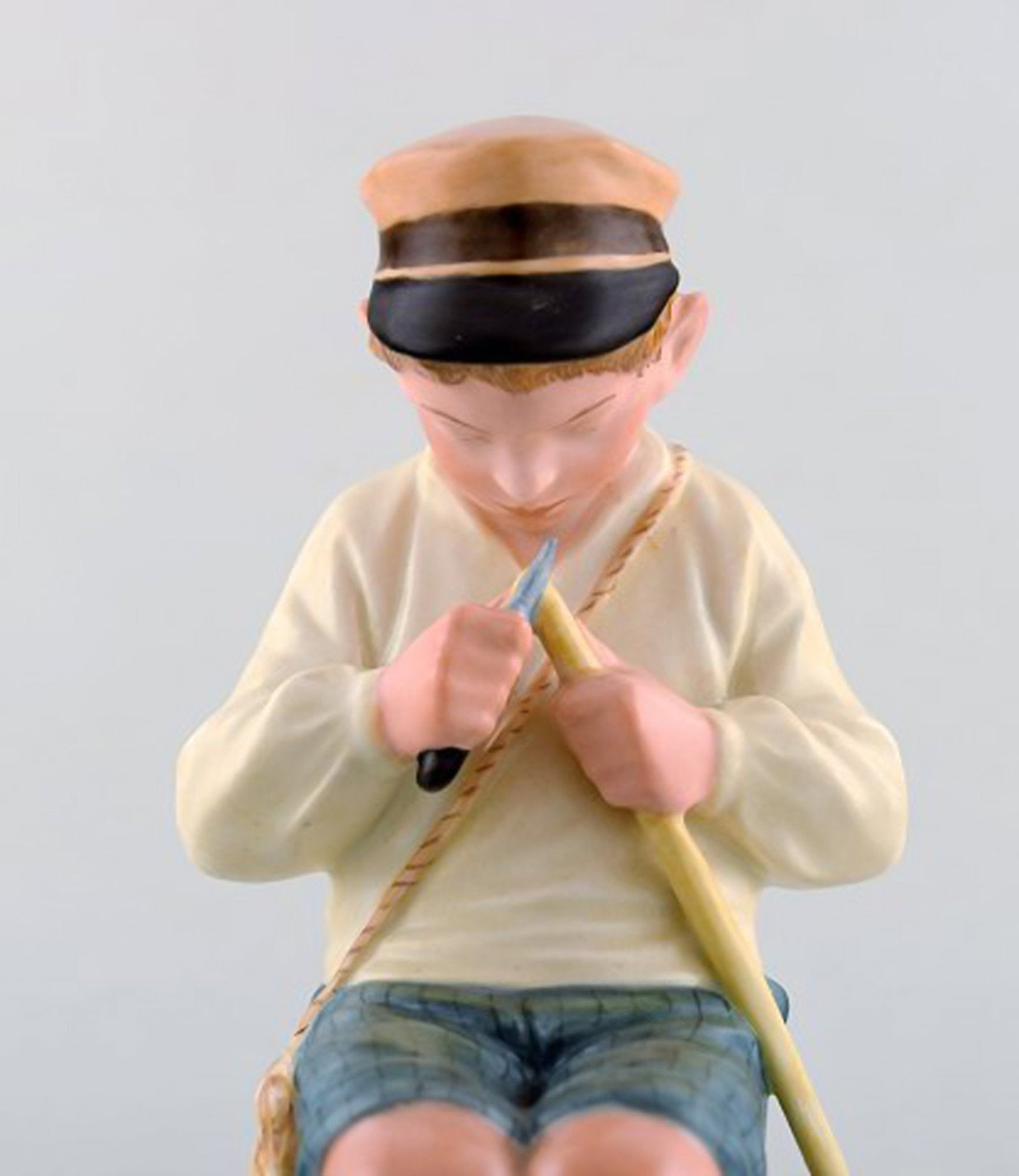 Royal Copenhagen porcelain figurine in high quality over glaze. Young boy. Model number 905. Dated - 4