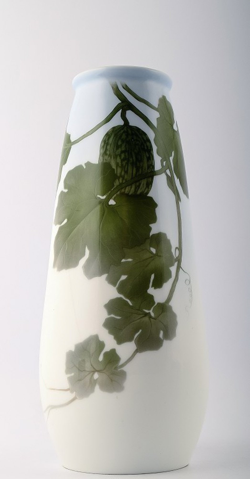 Royal Copenhagen vase decorated with watermelon plant.: Title: Royal Copenhagen vase decorated with watermelon plant. Description: Royal Copenhagen vase decorated with watermelon plant. Measures 27cm. x 16 cm. 2nd. factory quality, in perfect condition. Nu