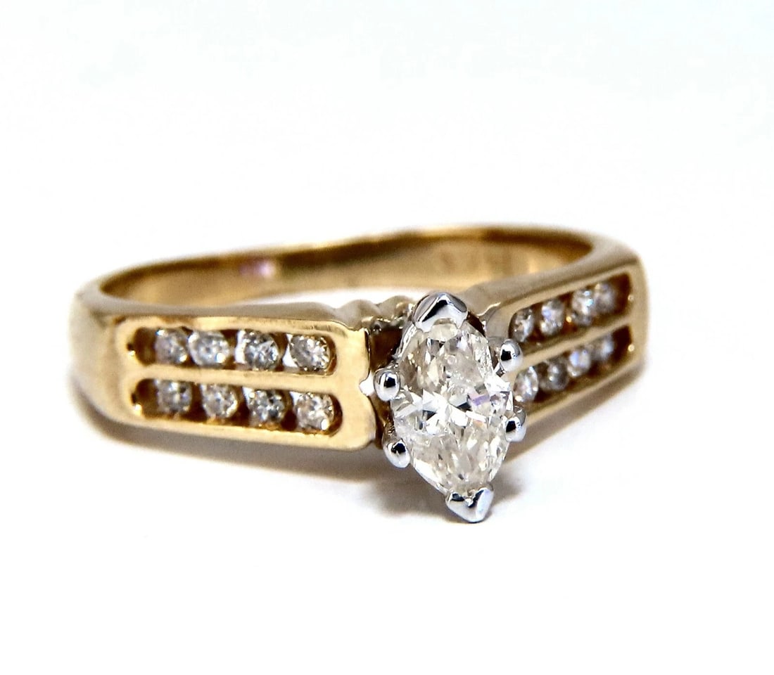 .50ct Marquise Natural Diamonds Cathedral Ring 14 Karat**: Title: .50ct Marquise Natural Diamonds Cathedral Ring 14 Karat** Description: Marquise Raised Cathedral .30ct. Marquise natural diamond Ring J-color, Si-2 clarity 5.4 x 3.6mm .20 round diamonds: