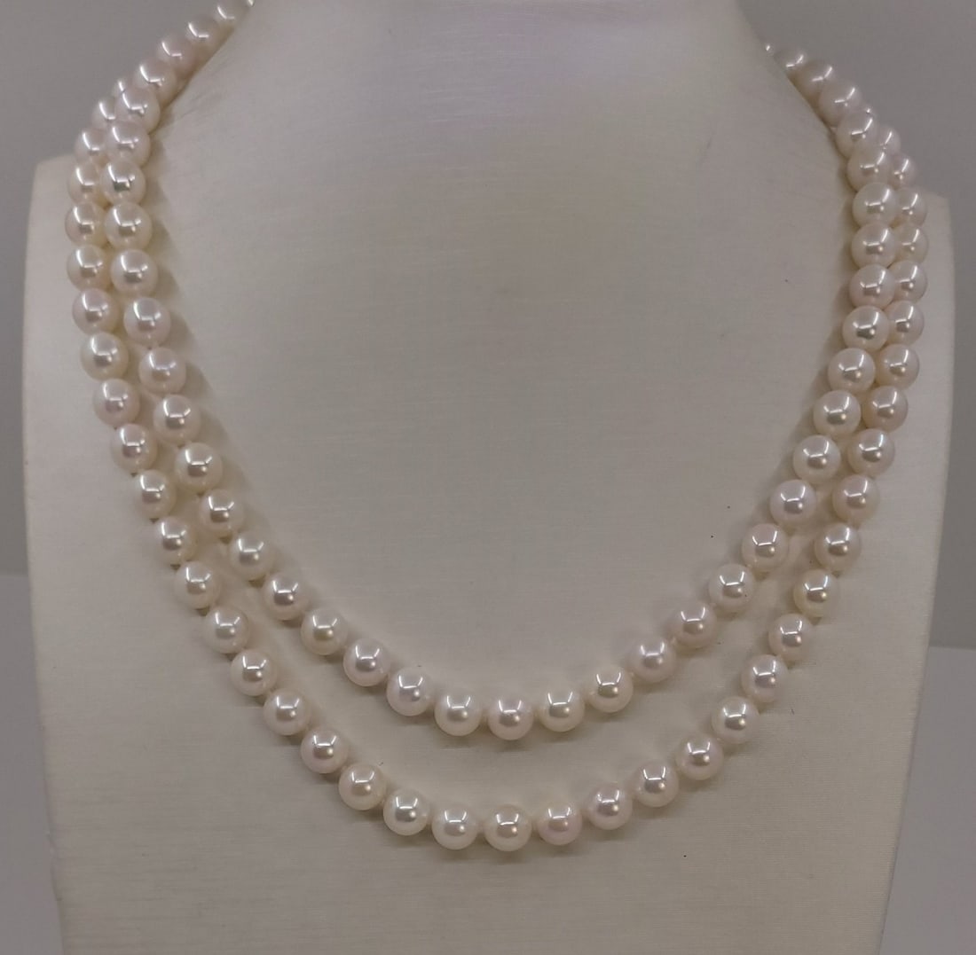 Necklace 7x7.5mm Double Akoya Pearls: Title: Necklace 7x7.5mm Double Akoya Pearls Description: A beautiful double pearl necklace of white saltwater Akoya pearls with exceptional lustre, finished with a 925 sterling silver clasp. This