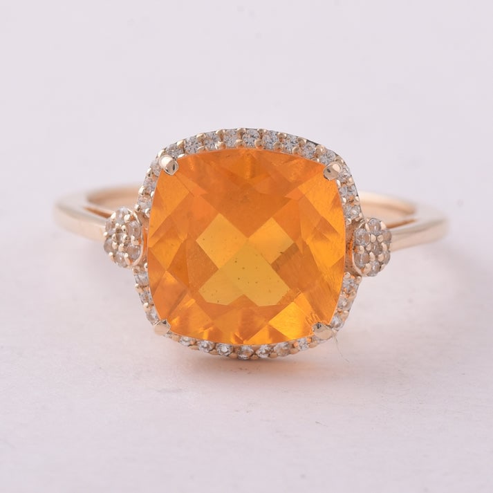 2.98 Ct Cushion Br.Opal 9K Gold Ring: 2.98 Total Carat Br.Opal 9K Gold Ring Specifications: Total Weight 2.44 g Center Gemstone Br.Opal Gemstone Carat Weight 2.8 Carats Gemstone Measurements 10X10 mm Additional Gemstones White Sapphire