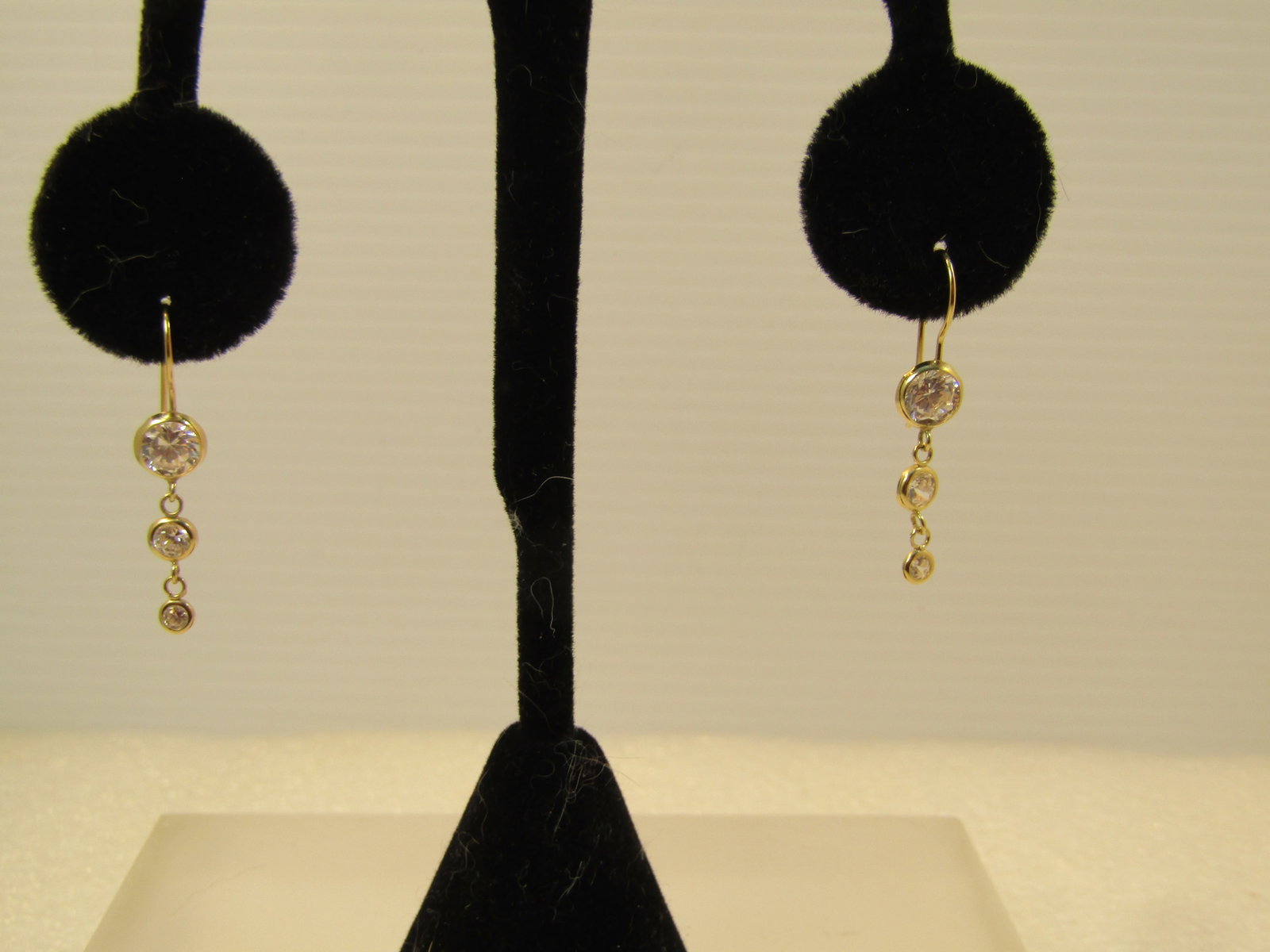 14kt Dangle Crystal/CZ Earrings, Pierced, 1990's: Title:14kt Dangle Crystal/CZ Earrings, Pierced, 1990's Description:14kt Dangle Crystal/CZ Earrings, Pierced, 1990's. These have hook posts with an appx. 6mm; 4mm; and 3mm clear stone set with a bezel