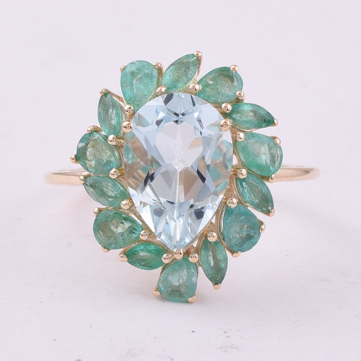 4.26 Ct Pear Aquamarine 9K Gold Ring: 4.26 Total Carat Aquamarine 9K Gold Ring Specifications: Total Weight 3.259 g Center Gemstone Aquamarine Gemstone Carat Weight 2.86 Carats Gemstone Measurements 12X8.40X5.70 mm Additional Gemstones Em