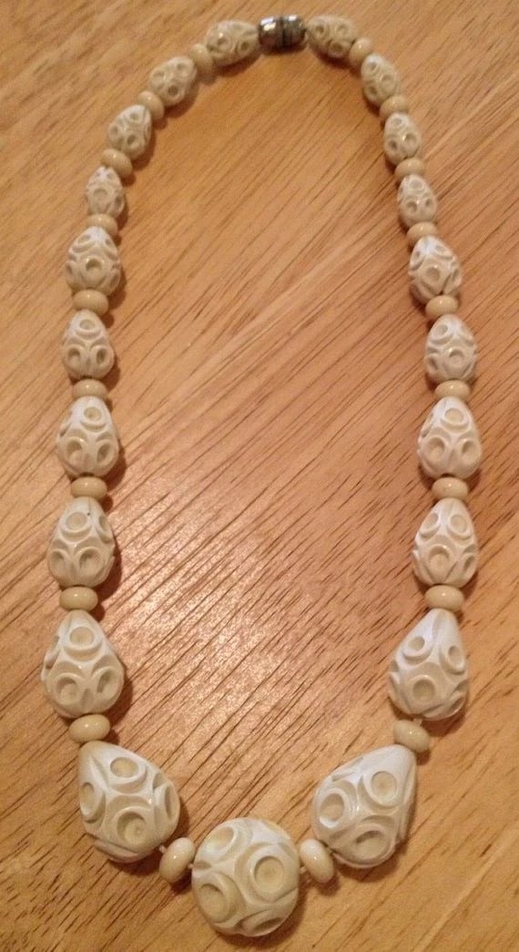Late 19th Century White Celluloid Necklace: Title:Late 19th Century White Celluloid Necklace Description:A necklace of early plastic molded in the late 19th century! Circa 1890's to 1920's.... This necklace measures 18 1/2" long.... The center 