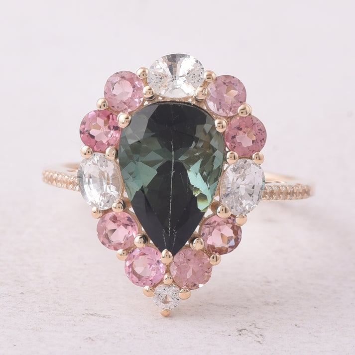4.24 Ct Pear Tourmaline 9K Gold Ring: 4.24 Total Carat Tourmaline 9K Gold Ring Specifications: Total Weight 2.978 g Center Gemstone Tourmaline Gemstone Carat Weight 2.53 Carats Gemstone Measurements 11X7.50X5.90 mm Additional Gemstones Wh