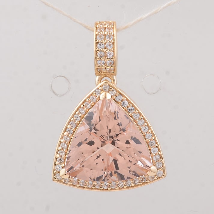 4.03 Ct Trillion Morganite 9K Gold Pendant: 4.03 Total Carat Morganite 9K Gold Pendant Specifications: Total Weight 2.57 g Center Gemstone Morganite Gemstone Carat Weight 3.79 Carats Gemstone Measurements 10.70X10.70X7 mm Additional Gemstones