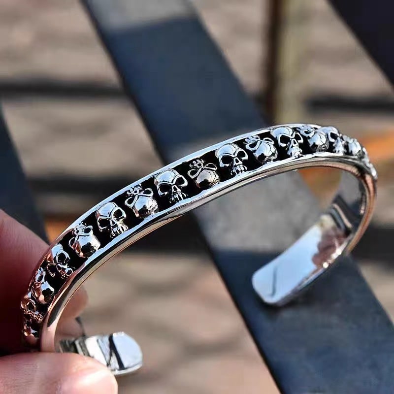 Minimal Skull Open Bangle - Titanium Steel: Title:Minimal Skull Open Bangle - Titanium Steel Description:Crafted from high-strength titanium steel, this slim skull bangle blends minimalist style with bold attitude. The open-ended design makes i
