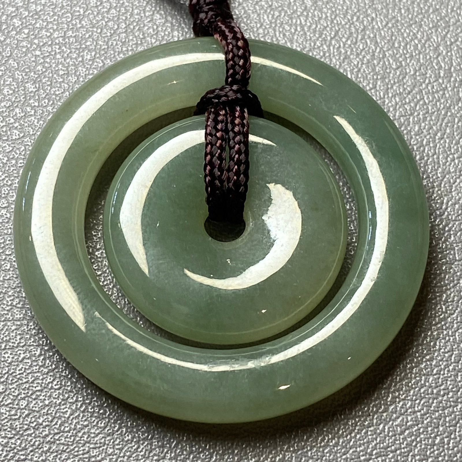 A pair natural Burmese ice jadeite jade concentric circle peace buckles: Title:A pair natural Burmese ice jadeite jade concentric circle peace buckles Description:This rare pair set of two natural Burmese ice jadeite concentric circle peace buckles, showcasing a captivatin