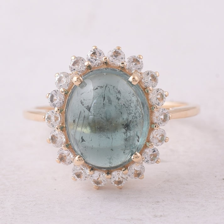 5.32 Ct Oval Tourmaline 9K Gold Ring: 5.32 Total Carat Tourmaline 9K Gold Ring Specifications: Total Weight 2.904 g Center Gemstone Tourmaline Gemstone Carat Weight 4.53 Carats Gemstone Measurements 11X9.20X5.50 mm Additional Gemstones
