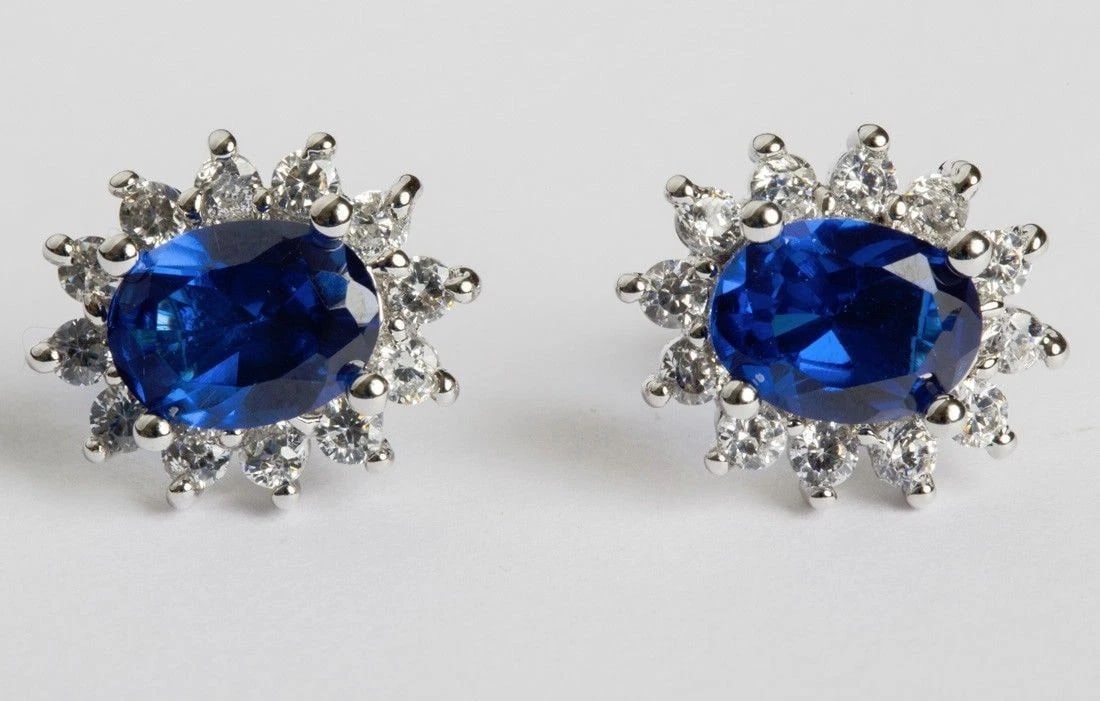 Faux Blue Sapphire and Clear Cubic Zirconia Earrings: Title:Faux Blue Sapphire and Clear Cubic Zirconia Earrings Description:Classic and must have earrings. Dead stock vintage. Circa 1980’s. These are silver sterling earrings with blue, oval cubic
