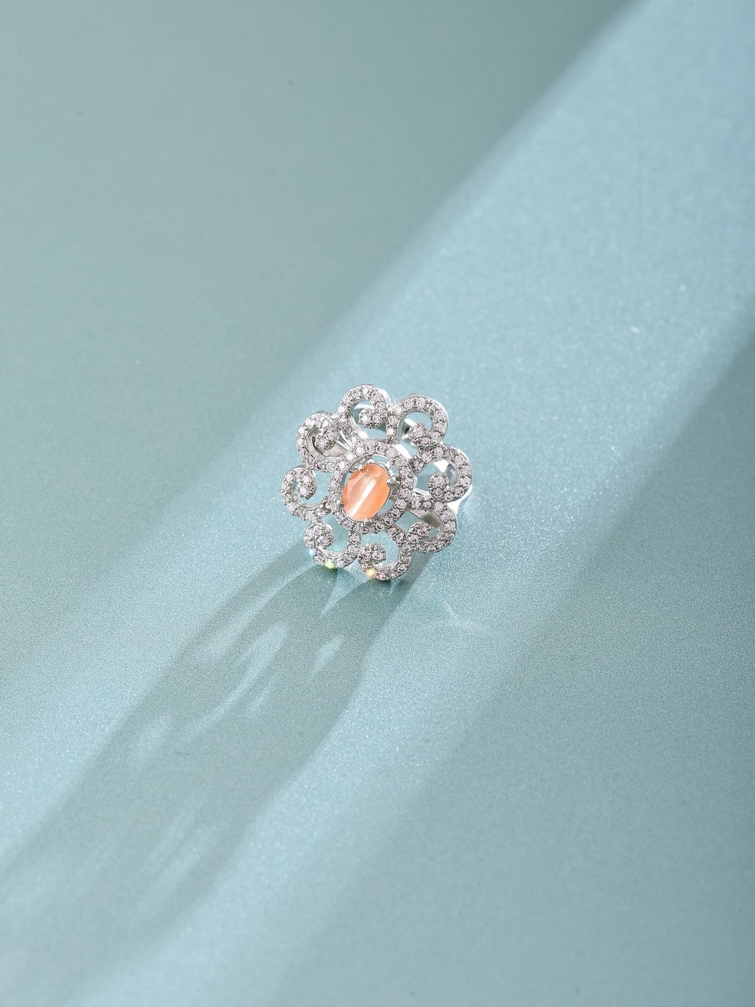 Floral Stone Studded Sterling Silver Ring with Peach Crystal Accent: Title:Floral Stone Studded Sterling Silver Ring with Peach Crystal Accent Reference:itemcode : JA0497 Reserve: $65.00 Shipping: Domestic: Shipping rates are determined by destination International: