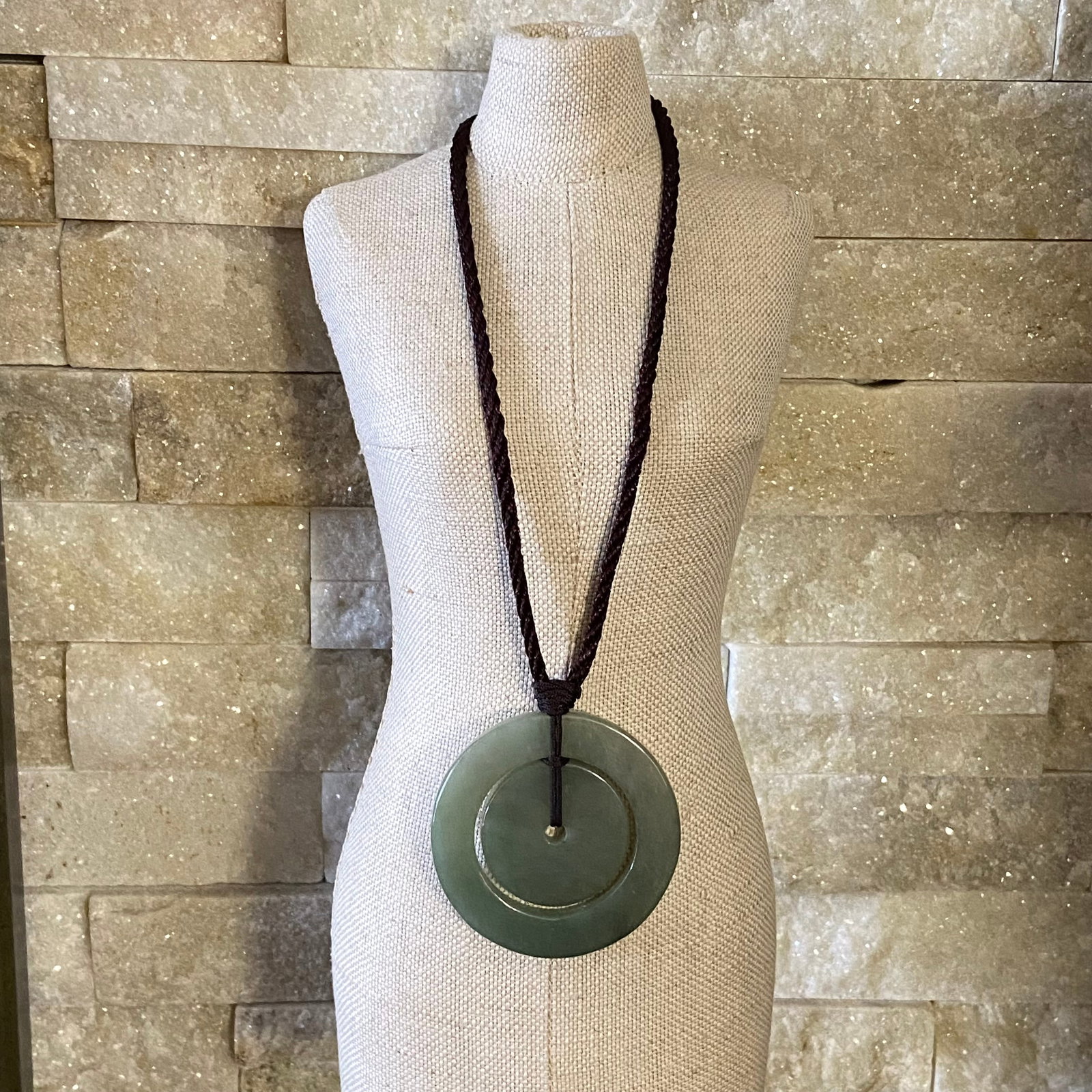 A large pair of Natural green jadeite Jade concentric circle peace buckles: Title:A large pair of Natural green jadeite Jade concentric circle peace buckles Description:A large pair of Natural green jadeite Jade concentric circle peace buckles This pair of green jadeite conce