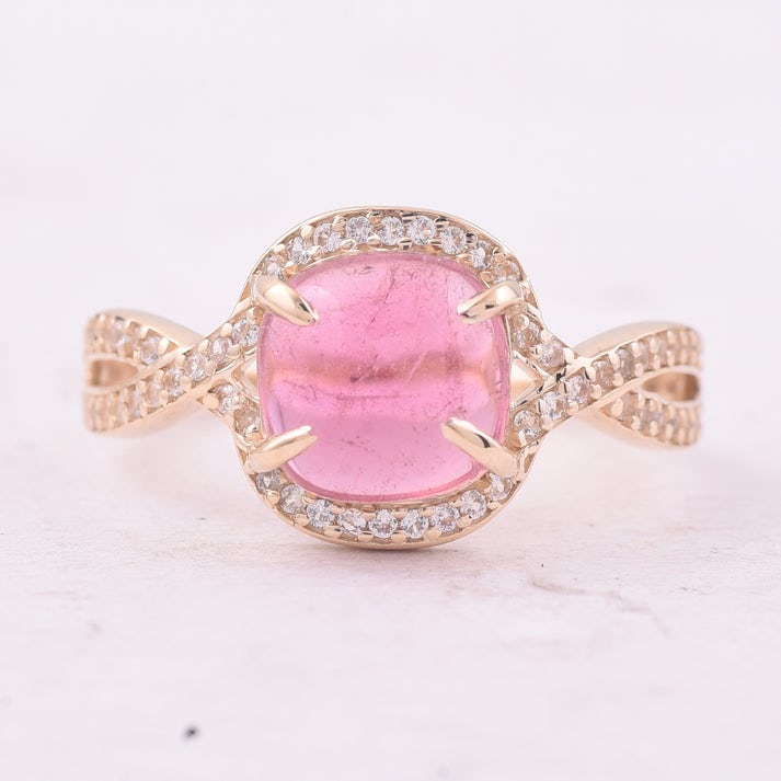 2.37 Ct Cushion Tourmaline 9K Gold Ring: 2.37 Total Carat Tourmaline 9K Gold Ring Specifications: Total Weight 2.175 g Center Gemstone Tourmaline Gemstone Carat Weight 2.11 Carats Gemstone Measurements 8X8 mm Additional Gemstones White