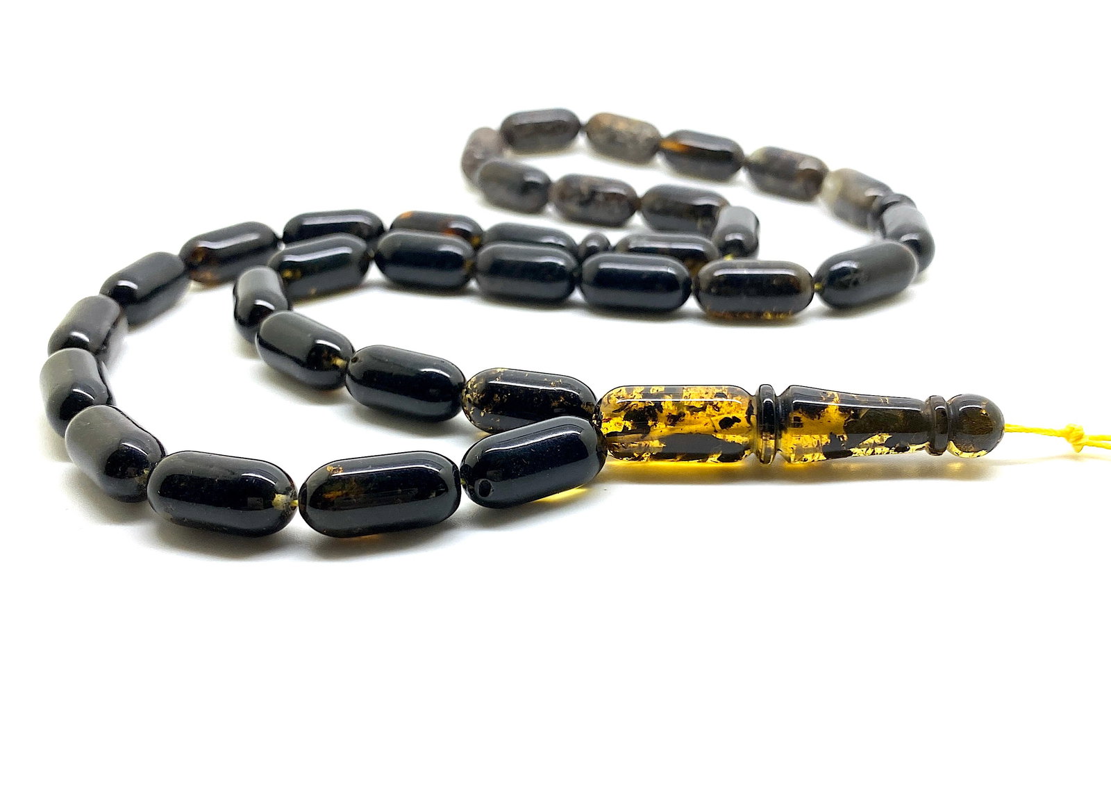 Amber Tesbih made from Barrel tablet shaped Amber beads: Title: Amber Tesbih made from Barrel tablet shaped Amber beads Metal: None Gemstone: Amber Weight: 25.9 g Size: Bead size: 16.0 x 8.0 mm Bead size: 0.63 x 0.315 inches Made of: (Reconstituted Amber