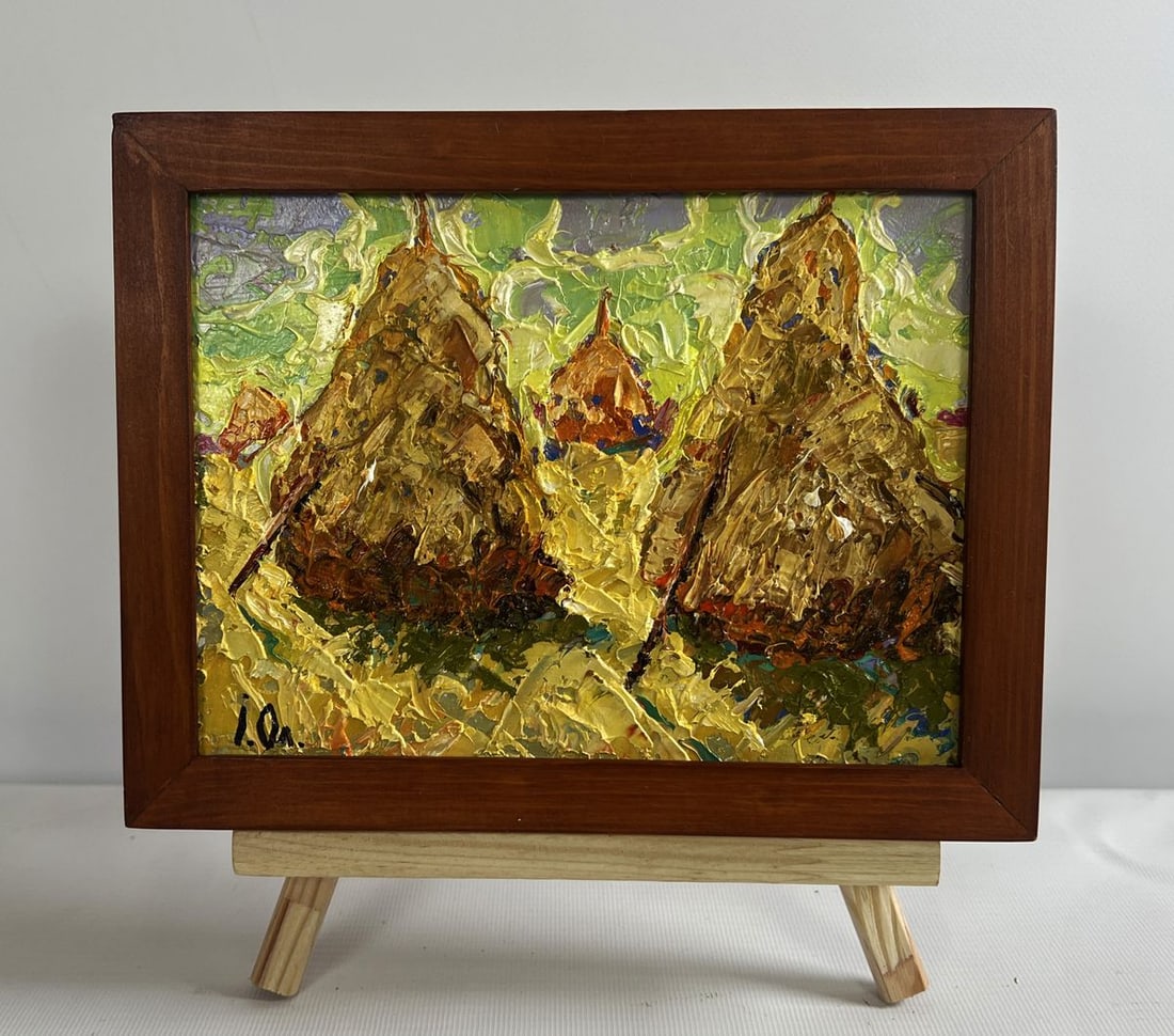 Oil painting Fresh haystacks in the field Alex Kalenyuk: No.AAA4716The oil painting on cardboard titled "Fresh Haystacks in the Field" captures the rustic charm of a pastoral landscape, where freshly harvested hay is neatly stacked under the vast open sky. 
