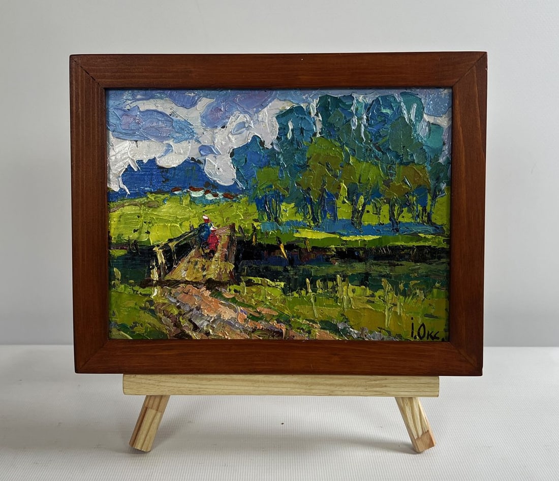 Oil painting To the other side Oksana Kalenyuk: No.AAA4731The oil painting on cardboard titled "To the Other Side" captures a tranquil and nostalgic rural scene, where nature and human presence harmoniously coexist. Through rich, expressive brushst