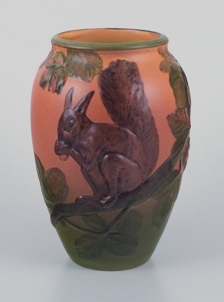 Ipsens Enke, Denmark. Ceramic vase with squirrel. Glazing in orange and green tones. 1920s/30s. - 2