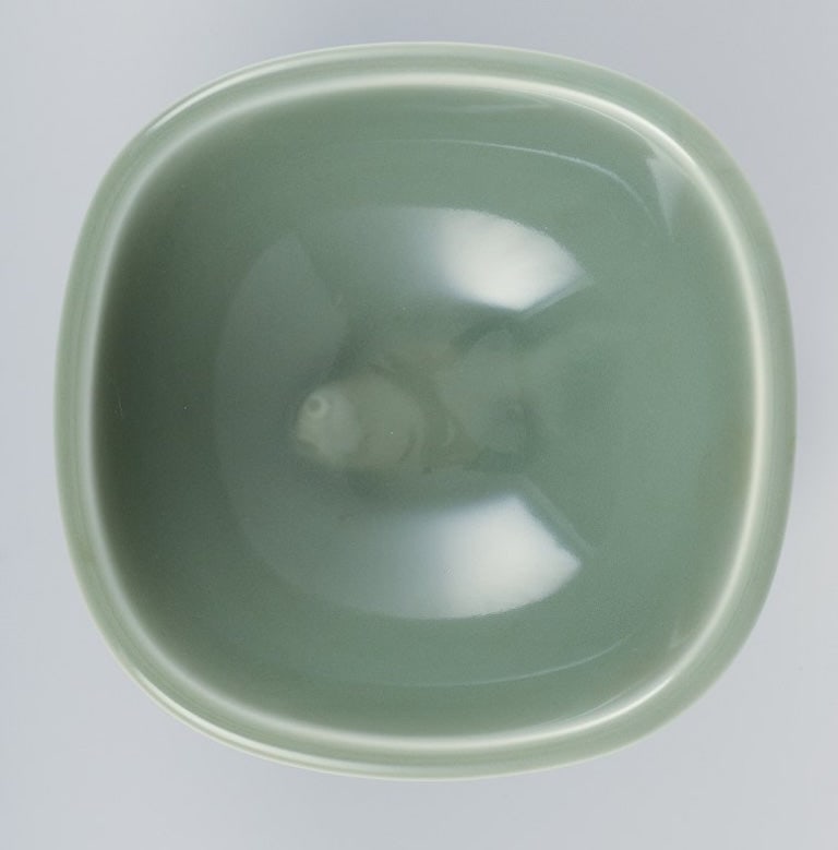 Nils Thorsson for Royal Copenhagen. Ceramic bowl in celadon glaze. Featuring a fish motif. Mid-20th - 5