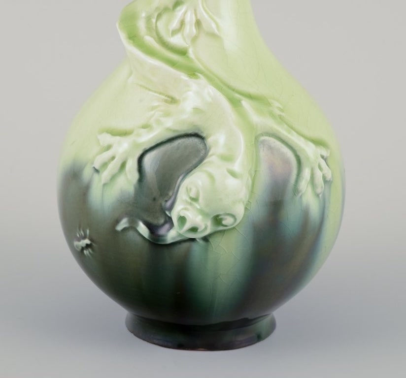 Rorstrand, Sweden. A pair of Art Nouveau faience vases with relief motif of lizards. Approximately - 7
