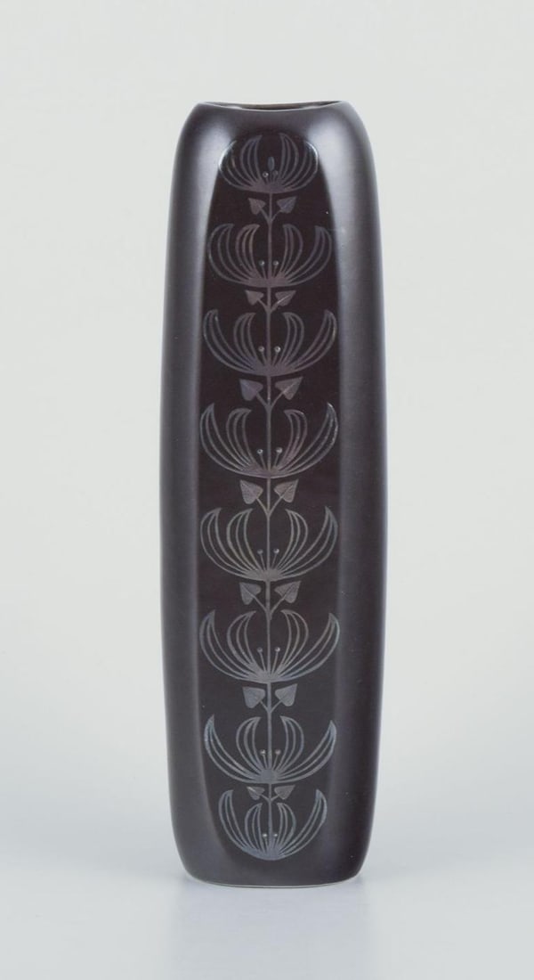Sven Johnson for Gustavsberg."Facett" ceramic vase. Motif of peacock and flowers. 1970s/80s.: Sven Johnson for Gustavsberg. "Facett" ceramic vase. Motif of peacock and flowers in silver decoration. Brown glaze. 1970s/80s. Marked. Perfect condition. Dimensions: Height 25.0 cm. x Width 7.0 cm.