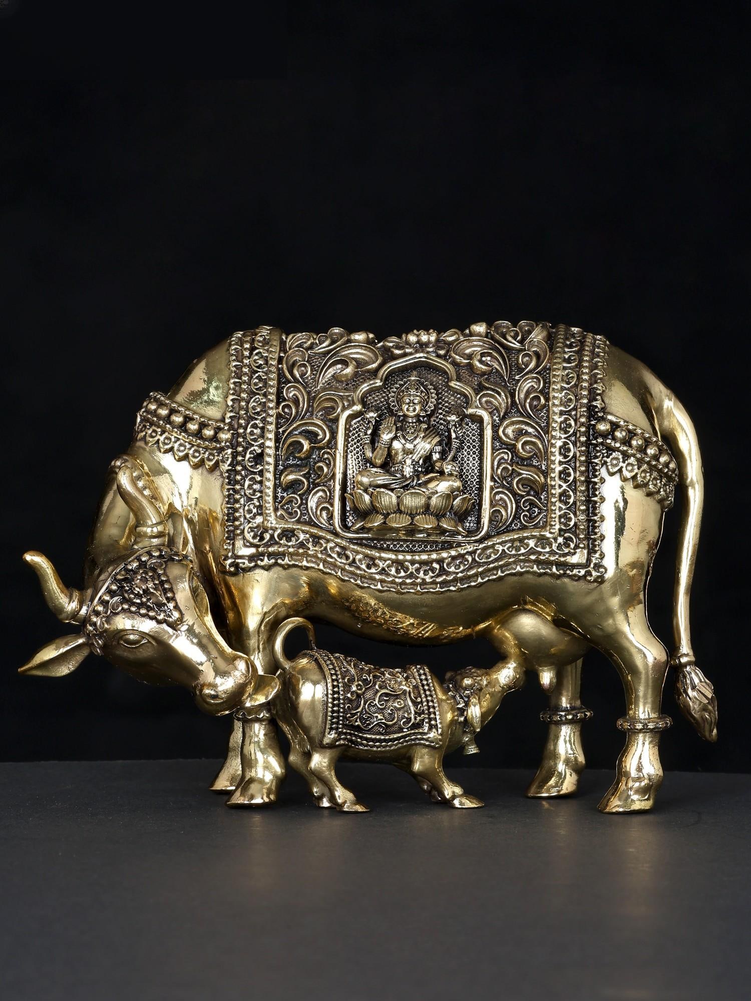 7" Superfine Divine Cow and Calf with Lakshmi Ganesha Engraving | Brass Statue: Title: 7" Superfine Divine Cow and Calf with Lakshmi Ganesha Engraving | Brass Statue Additional Information: itemcode: DDO090 Reserve: $212.00 Shipping: Domestic: Shipping rates are determined by