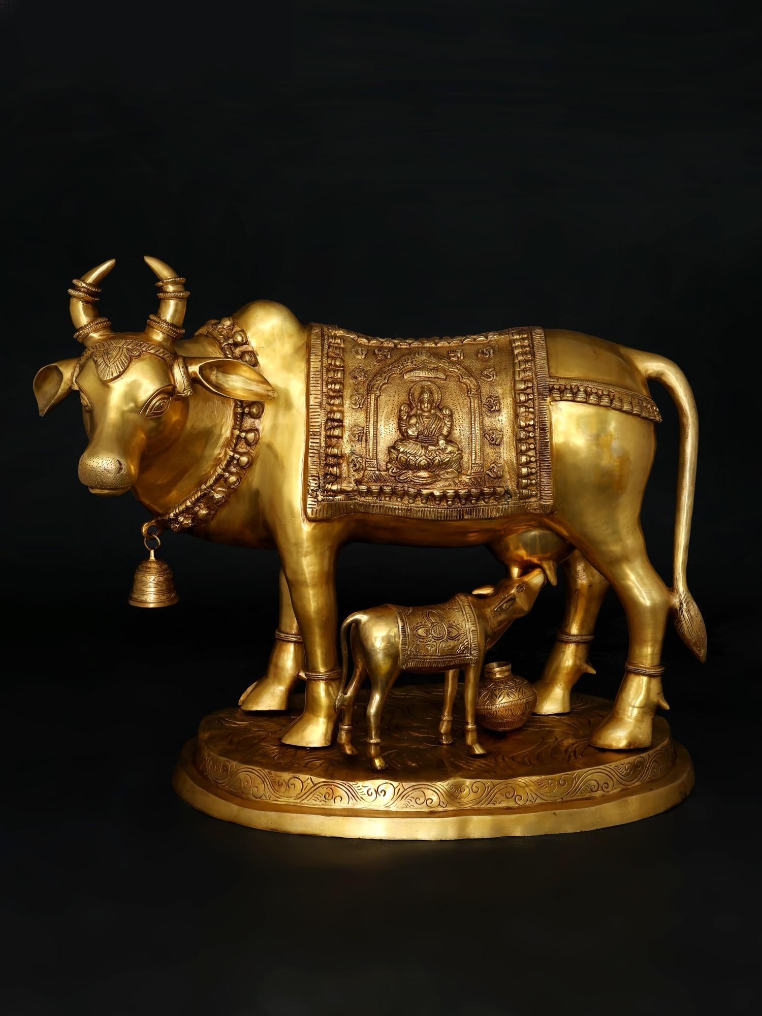 34" Large Size Cow and Calf with Lakshmi Ganesha Carving | Brass Statue: Title: 34" Large Size Cow and Calf with Lakshmi Ganesha Carving | Brass Statue Additional Information: itemcode: DDO213 Reserve: $3,131.00 Shipping: Domestic: Shipping rates are determined by destinat