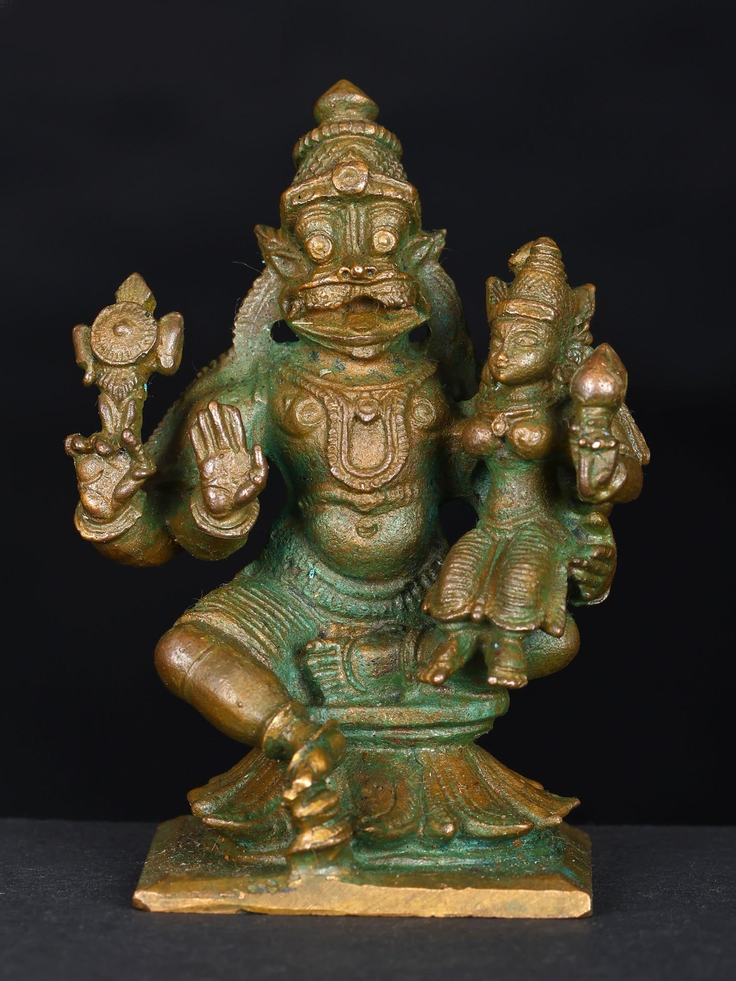 2" Small Sitting Lord Narasimha with Devi Lakshmi | Bronze Statue: Title: 2" Small Sitting Lord Narasimha with Devi Lakshmi | Bronze Statue Additional Information: itemcode: DDN848 Reserve: $88.00 Shipping: Domestic: Shipping rates are determined by destination