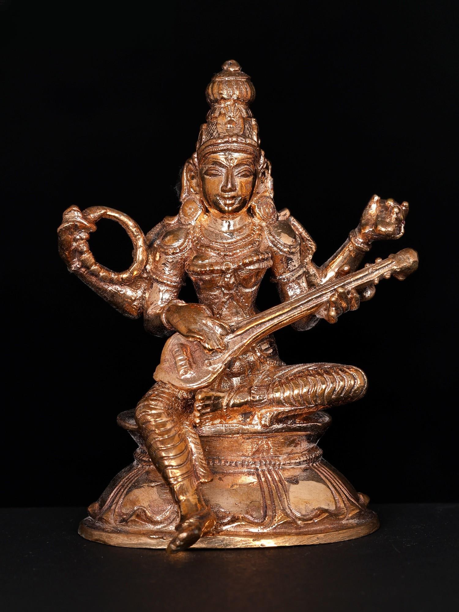 3" Small Devi Saraswati Seated in Lalitasana | Bronze Statue: Title: 3" Small Devi Saraswati Seated in Lalitasana | Bronze Statue Additional Information: itemcode: DDO019 Reserve: $154.00 Shipping: Domestic: Shipping rates are determined by destination