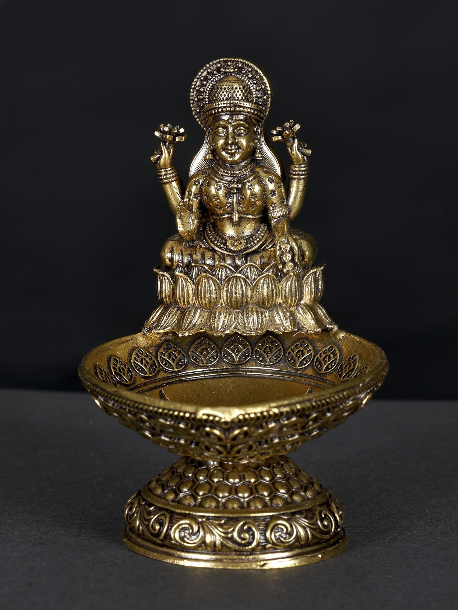 3" Small Superfine Brass Goddess Lakshmi Diya/Lamp: Title: 3" Small Superfine Brass Goddess Lakshmi Diya/Lamp Additional Information: itemcode: DDN623-Natural Brass Reserve: $47.00 Shipping: Domestic: Shipping rates are determined by destination