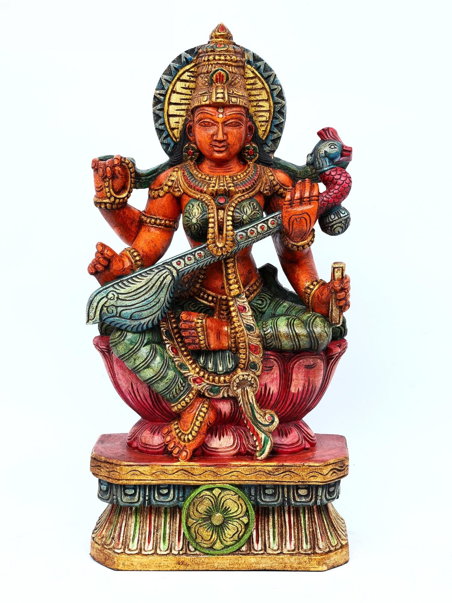 24"Goddess Saraswati Seated on Lotus | Wood Carving: Title: 24"Goddess Saraswati Seated on Lotus | Wood Carving Additional Information: itemcode: DDO222 Reserve: $512.00 Shipping: Domestic: Shipping rates are determined by destination International: