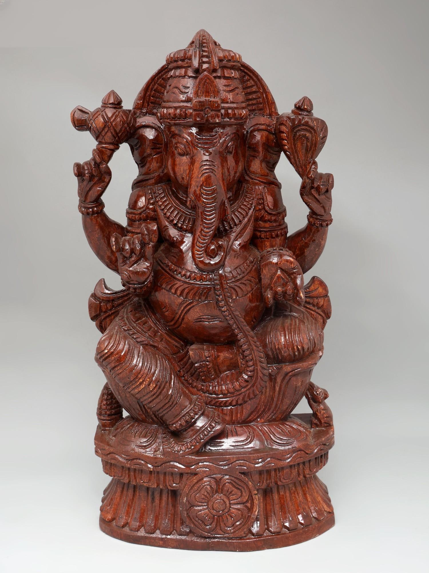 24" Four Armed Lord Ganesha | Wood Carving: Title: 24" Four Armed Lord Ganesha | Wood Carving Additional Information: itemcode: DDO665 Reserve: $388.00 Shipping: Domestic: Shipping rates are determined by destination International: Foreign ship
