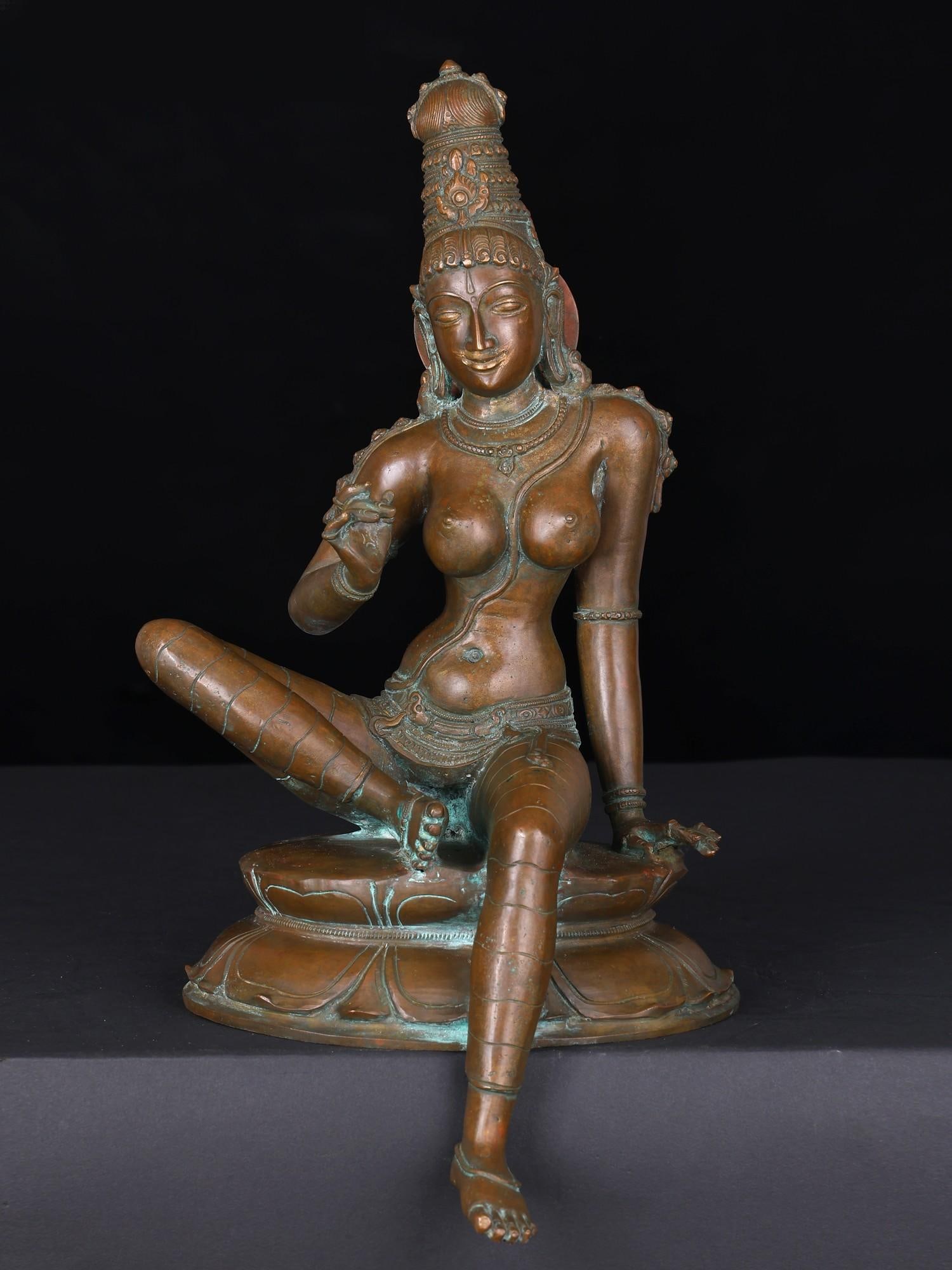 12" Devi Uma (Goddess Parvati) Seated in Lalitasana | Bronze Statue: Title: 12" Devi Uma (Goddess Parvati) Seated in Lalitasana | Bronze Statue Additional Information: itemcode: DDN982 Reserve: $854.00 Shipping: Domestic: Shipping rates are determined by destination In