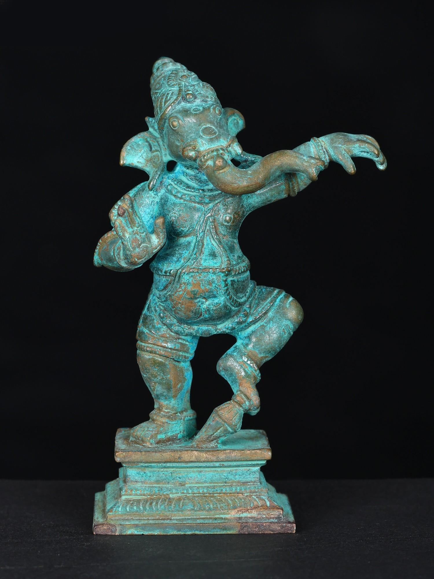 3" Small Dancing Lord Ganesha Bronze Statue: Title: 3" Small Dancing Lord Ganesha Bronze Statue Description: Nritya Ganapati or Narthan Vinayakar is one of the most divine and dynamic images in Tamil bronzes. This small icon brings the animated 